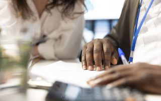 2 people looking at a contract